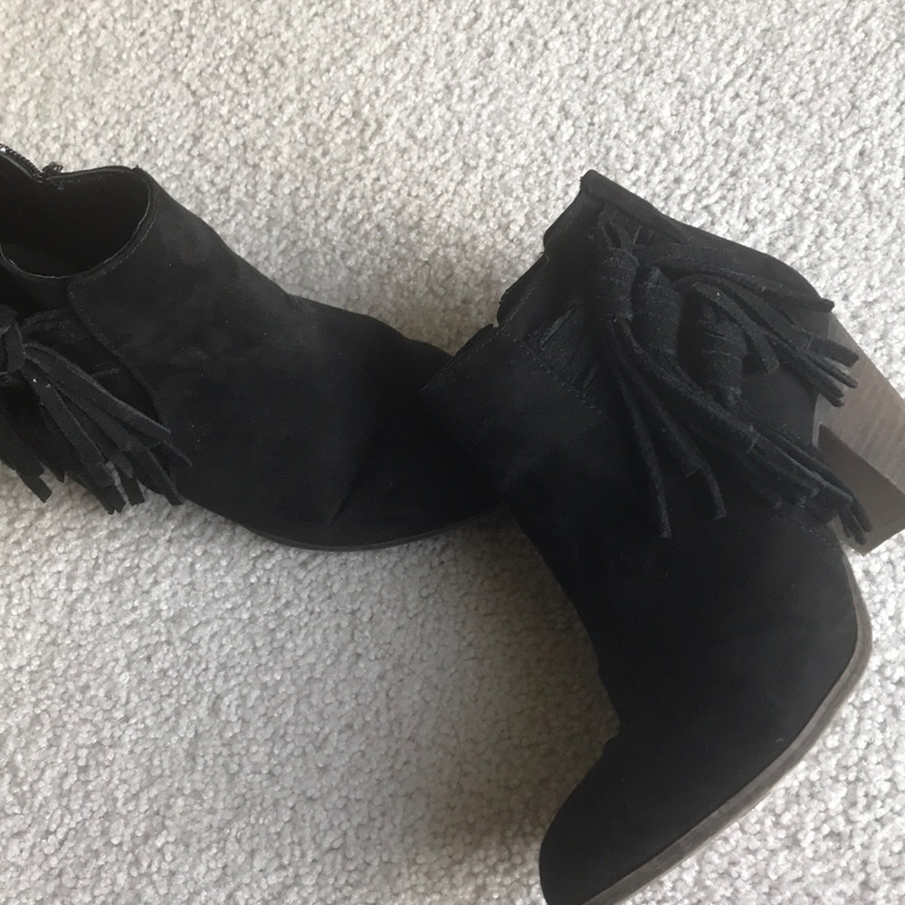 Cute black booties with fringe detail!